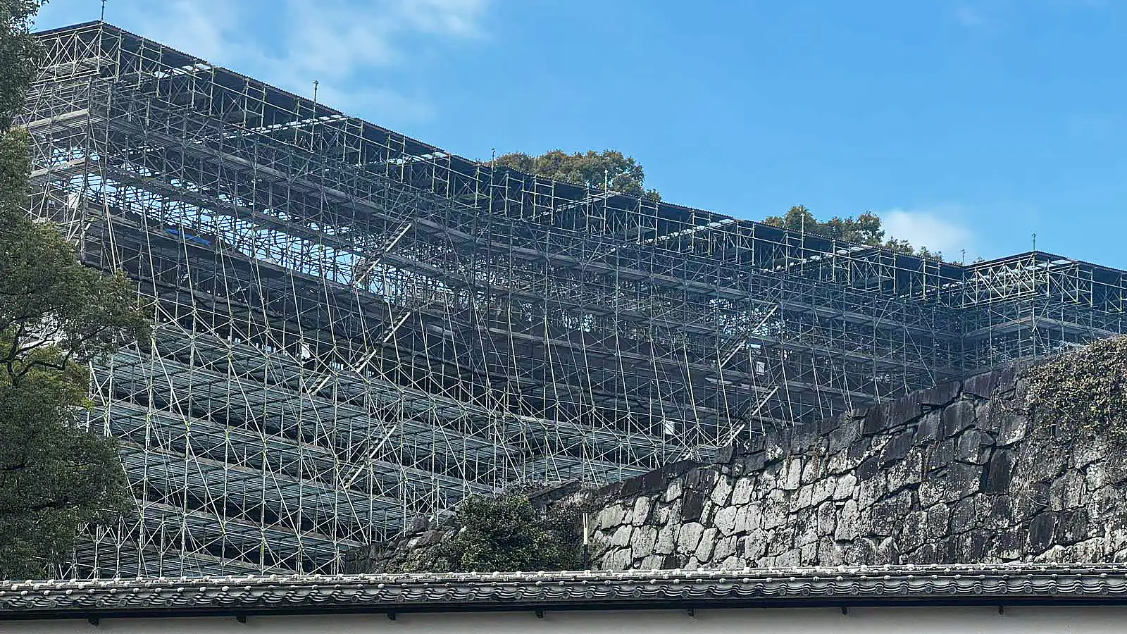 Large restoration scaffolding structure installed during a historic preservation project in Japan