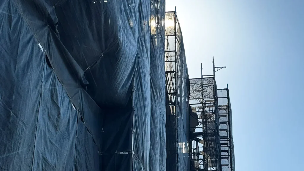 External scaffold stairway and working platforms showing site access conditions
