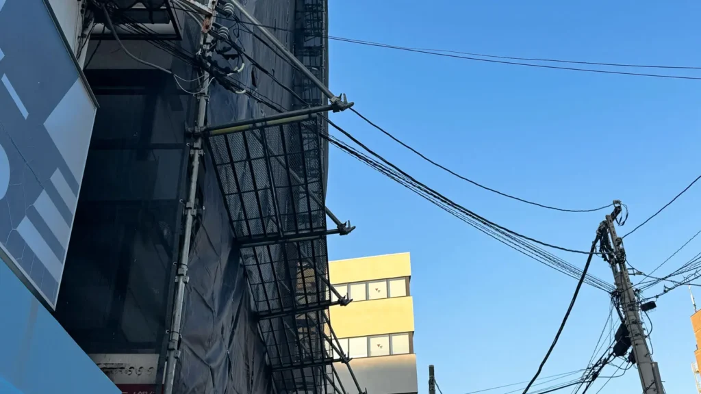 Scaffold installed close to overhead utility lines showing a real site constraint