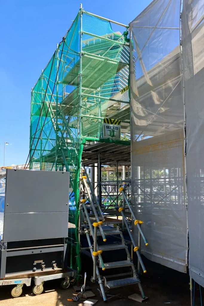 Scaffold stair access installed beside the main scaffold in a restricted construction site