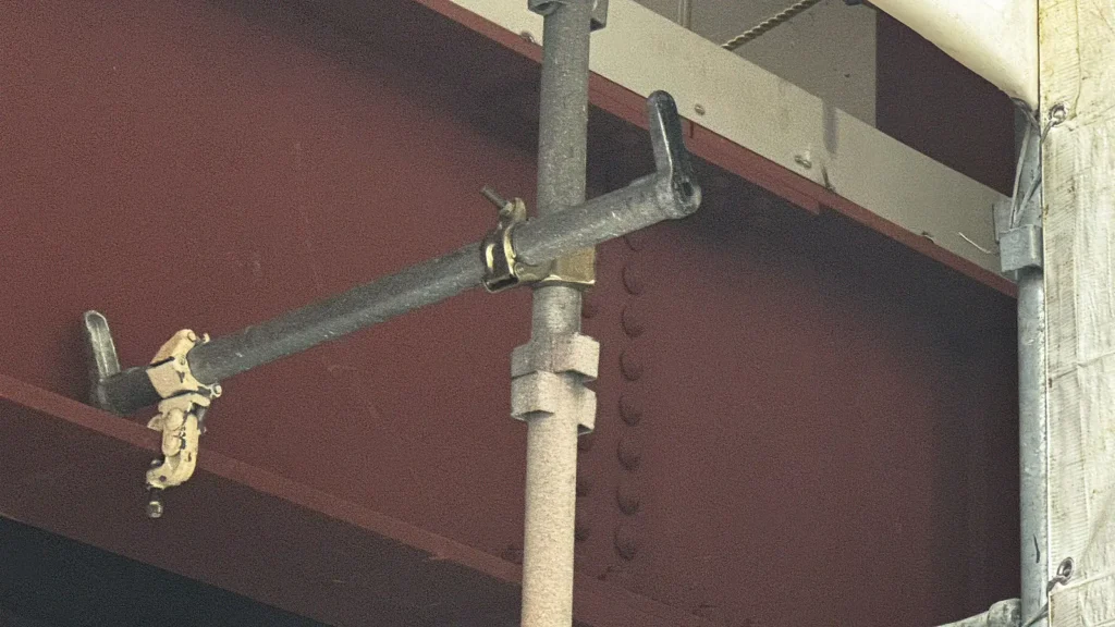 Scaffold tie connected at an alternative position where the standard fixing location is obstructed by the building structure