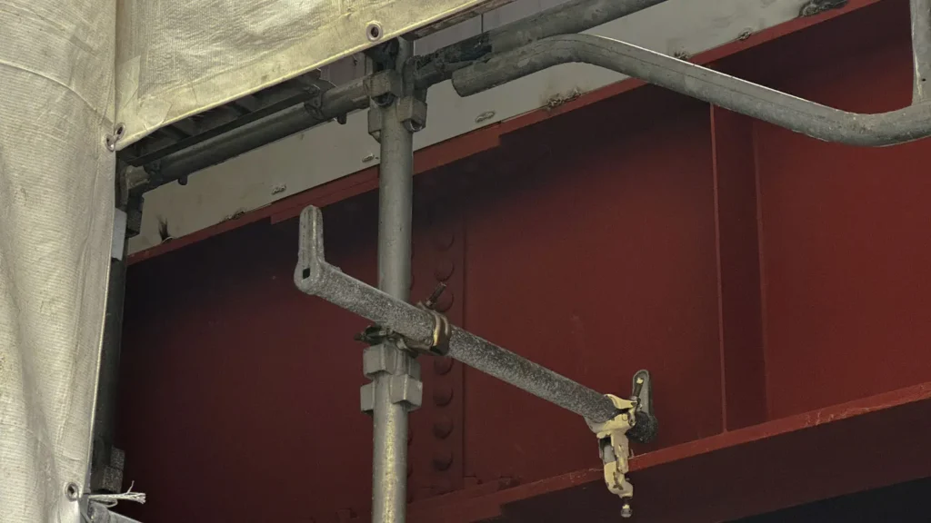 Scaffold tie connection to building structure