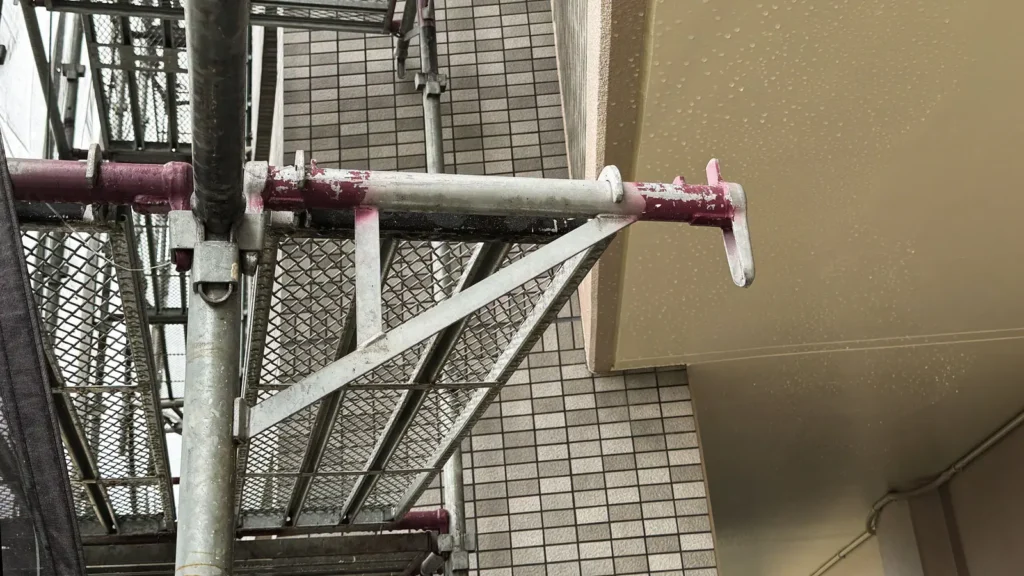 Scaffold tie positioned near a building projection showing a site-specific interface condition