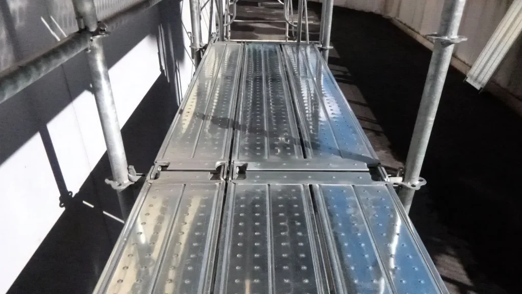 Scaffold working platform with metal decks showing practical platform width and layout